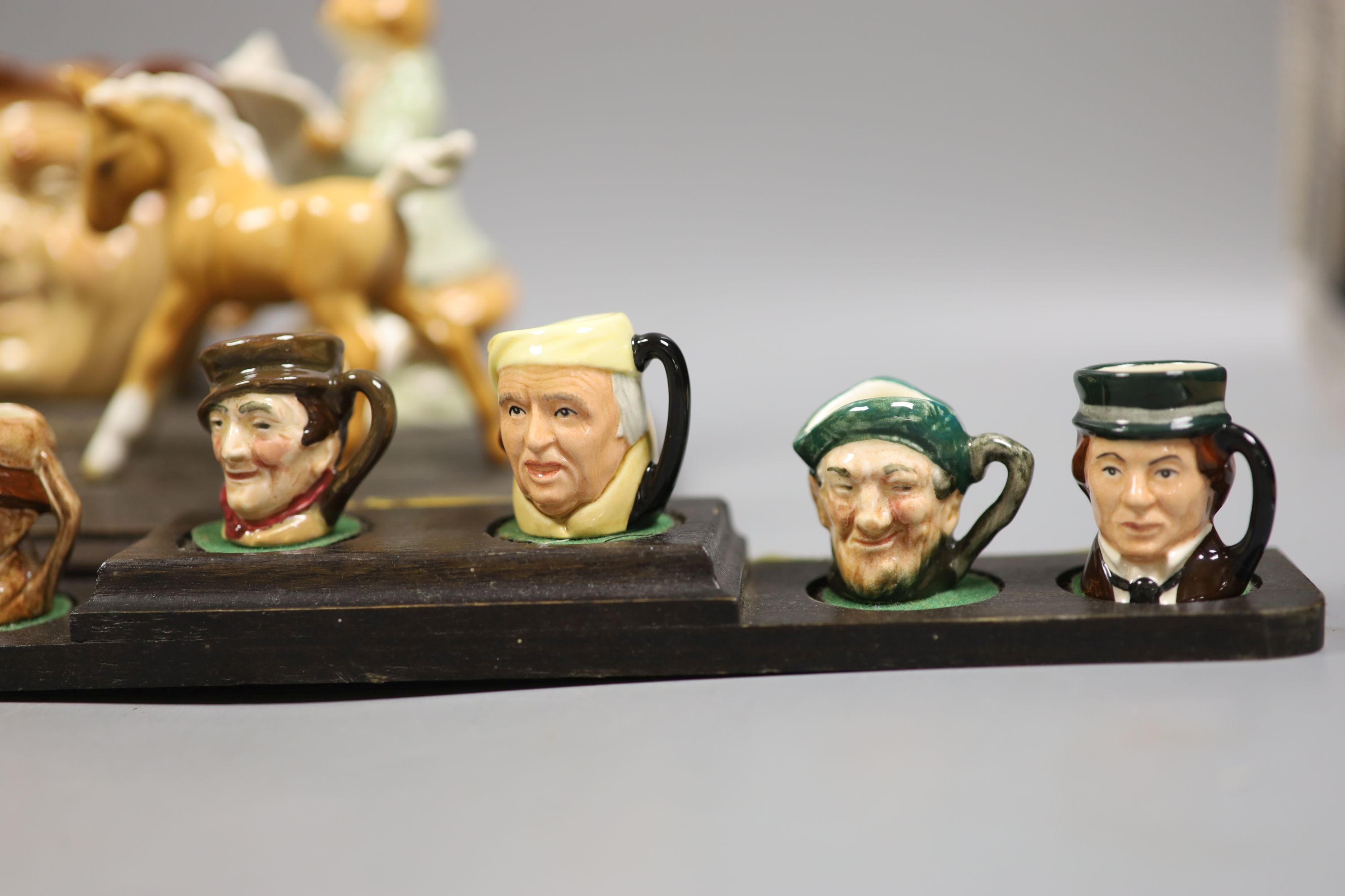 A collection of Royal Doulton miniature character mugs, figurines, series plate etc